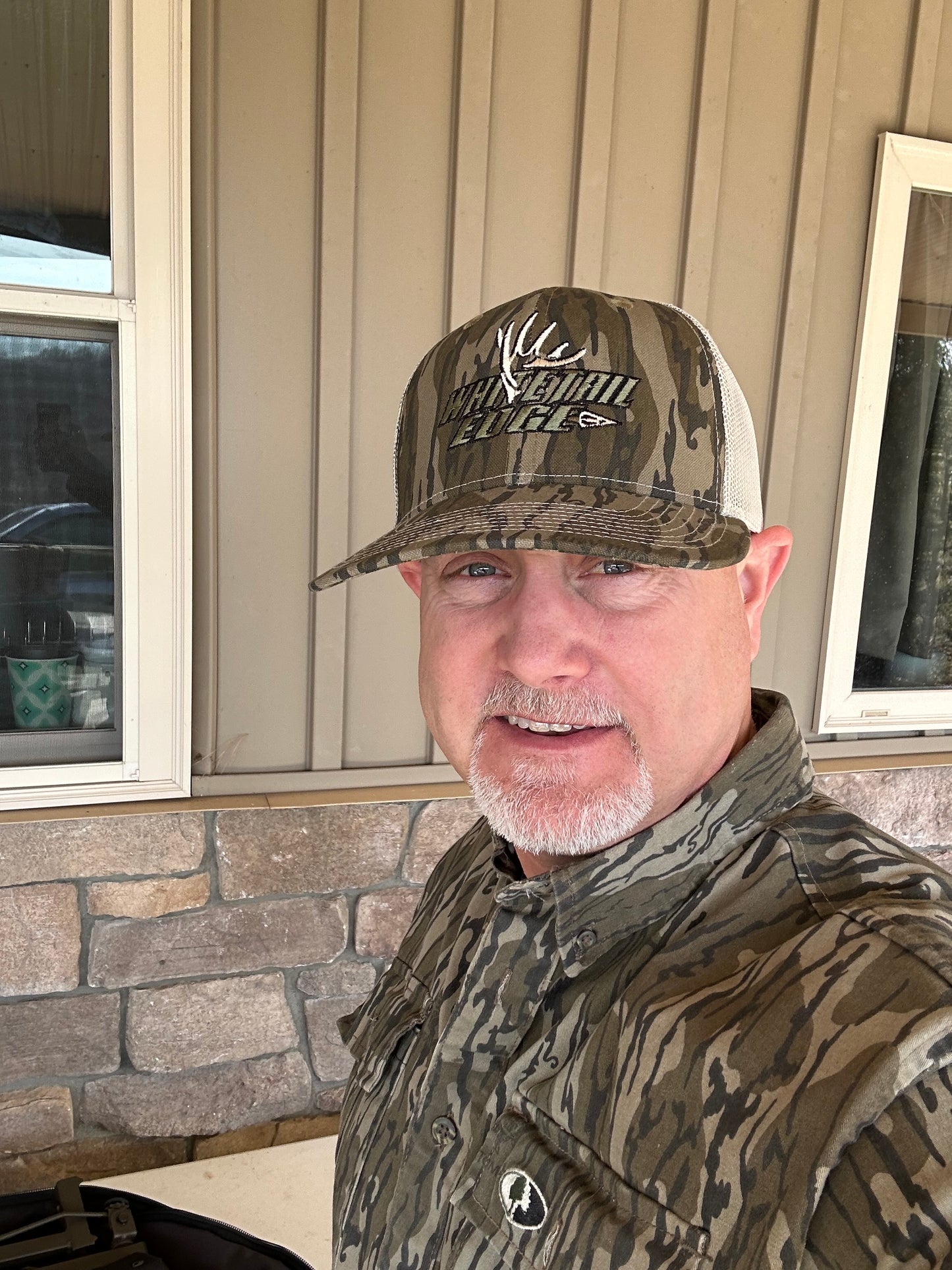 Mossy oak Bottomland/tan with darker logo